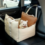Beige faux leather waterproof dog car seat bed with high sides and safety straps, ideal as a cat tower or scratcher.