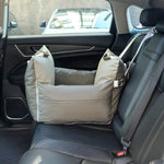 Gray waterproof faux leather 3-in-1 dog car seat bed secured on the back seat of a black car interior