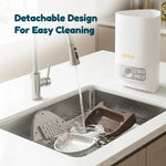Disassembled automatic pet feeder parts laid out for easy cleaning